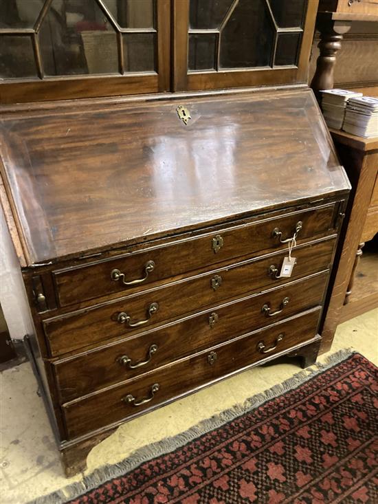 A George III mahogany bureau bookcase, width 100cm, depth 52cm and 26cm top, height 221cm